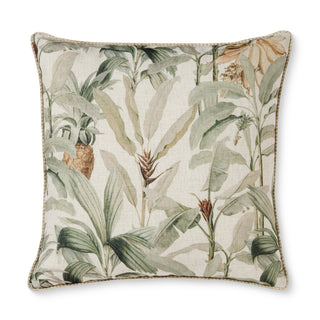 Decorative pillow with tropical leaf pattern on a white background