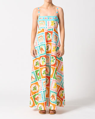 Woman wearing a colorful patterned dress on a white background