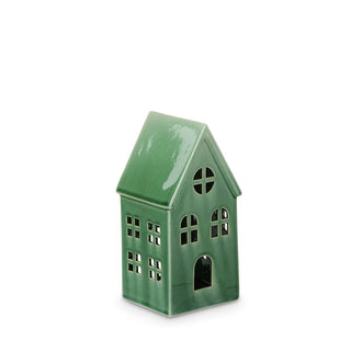 Green ceramic house-shaped lantern on a white background