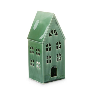 Green ceramic house-shaped lantern on a white background