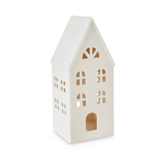 White house-shaped lantern with cut-out windows on a white background