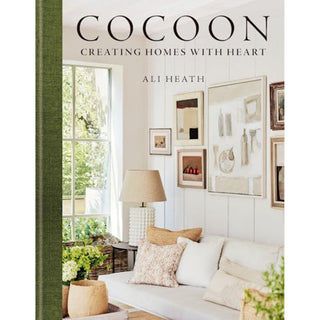 Book cover of 'Cocoon: Creating Homes with Heart' by Ali Heath, featuring a living room interior.