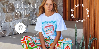 Woman wearing a white t-shirt with text, sitting on colorful bags with 'Vita Dolce' branding, surrounded by 'Fashion Sale' text and graphics.