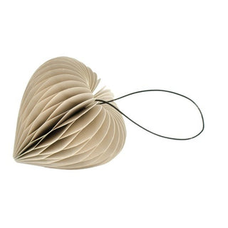 Heart-shaped object made of folded paper with a string on a white background