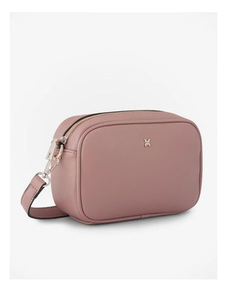 Pink crossbody bag with a visible brand logo on a white background