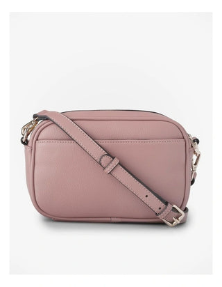 Pink crossbody bag on a white background