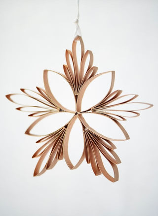 Decorative hanging object with a star design on a white background
