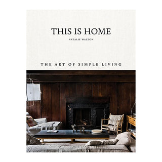 Book cover of 'This is Home: The Art of Simple Living' by Natalie Walton with a living room scene.