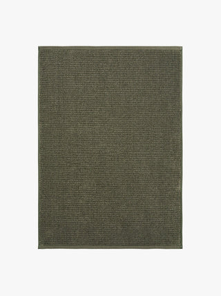Solid green rectangular rug on a white background