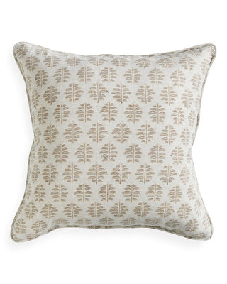 Decorative pillow with leaf pattern on a white background
