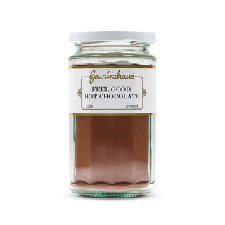 Jar of 'Feel Good Hot Chocolate' with a white label on a white background