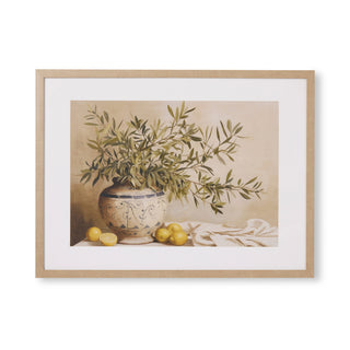 Framed artwork of a still life with a vase, leaves, and lemons on a beige background