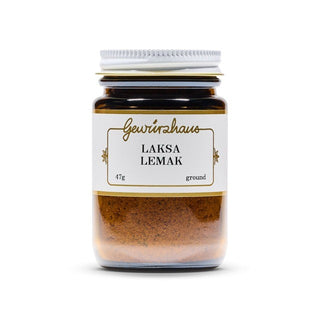 Jar of Laksa Lemak spice mix with a white label on a white background
