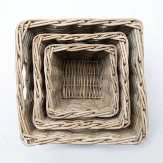 Set of nested wicker baskets on a white background