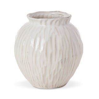 White ceramic vase with ribbed texture on a white background