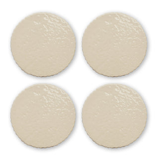 Four round beige coasters on a white background