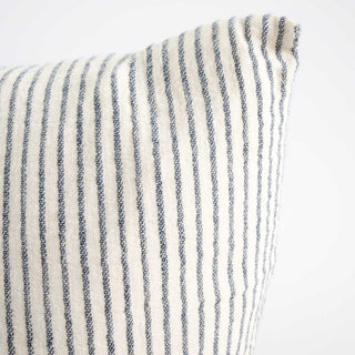 Close-up of a striped fabric with blue and white lines on a white background