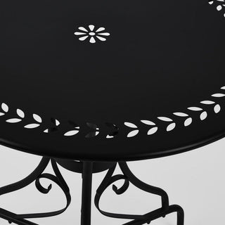 Black metal table with decorative white patterns on a white background
