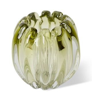 Green glass vase with a textured surface on a white background