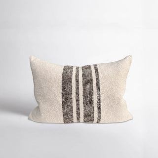 Textured pillow with horizontal stripes on a light gray background