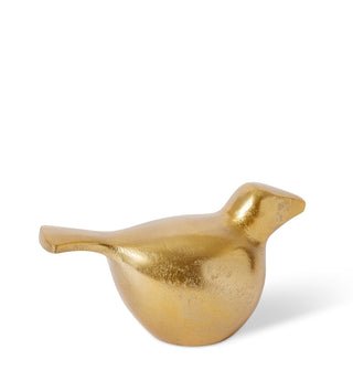 Gold bird-shaped decorative object on a white background
