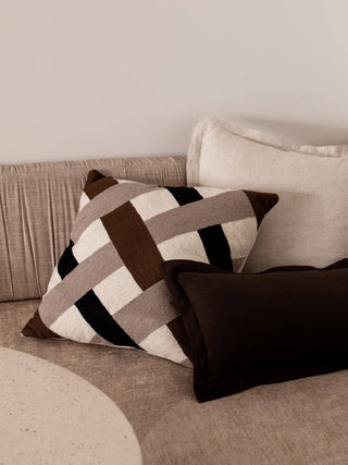 Decorative pillows on a sofa with a neutral color scheme