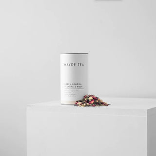 Mayde Tea Green Sencha, Jasmine & Rose canister with loose tea on a white surface