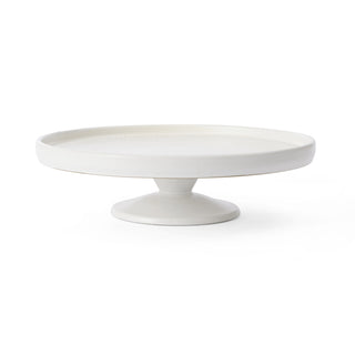 White ceramic cake stand on a white background
