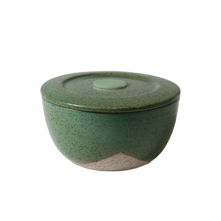 Green ceramic bowl with a lid on a white background