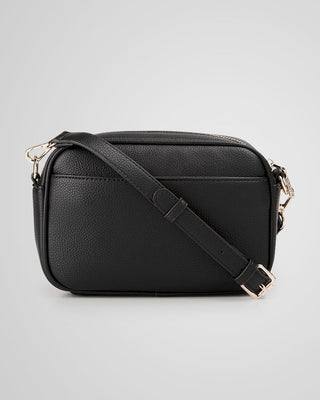 Black leather crossbody bag on a light gray background