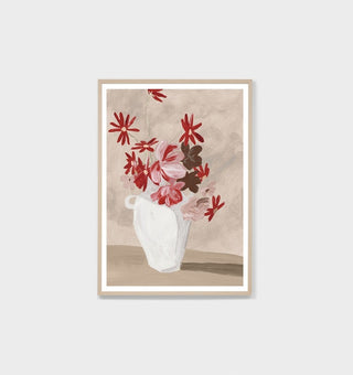 Framed artwork of a white vase with red and pink flowers on a beige background
