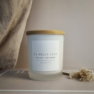 Candle with 'La Bella Luce' label on a neutral background