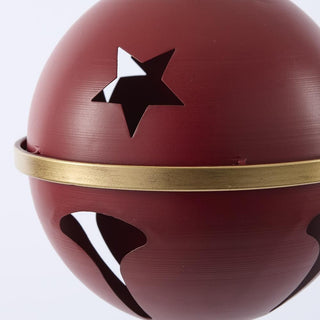 Red ball with a gold band and black star on a white background