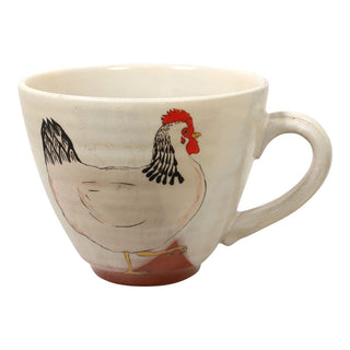 Ceramic mug with a rooster design on a white background
