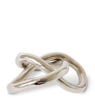 Two interlocking silver rings on a white background