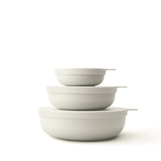 Set of three white bowls stacked on a white background