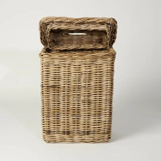 Wicker laundry basket with a lid on a white background