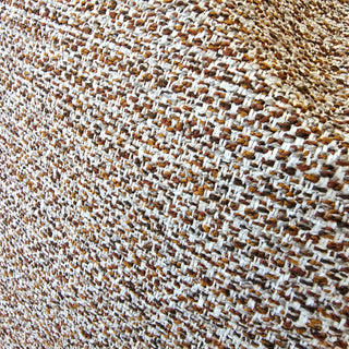Close-up of a textured fabric with brown and beige pattern