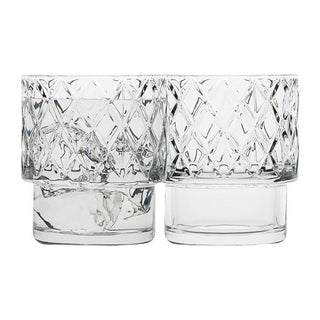 Two clear glass tumblers with diamond pattern on a white background