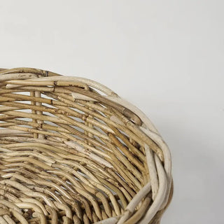 Close-up of a wicker basket on a light gray background