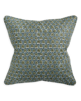 Patterned pillow with green and blue design on a white background
