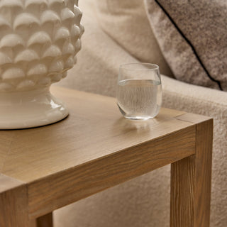 Glass of water on a wooden table with decorative elements