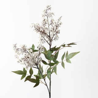 Artificial plant with green leaves and white flowers on a white background