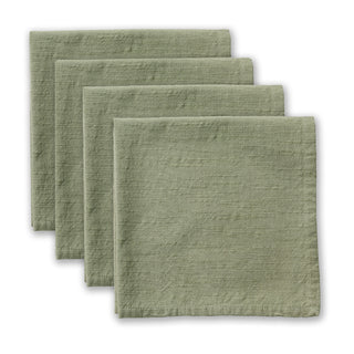 Set of four green napkins on a white background