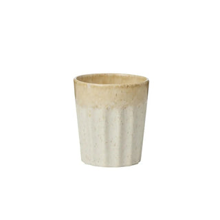 Ceramic cup with two-tone design on a white background