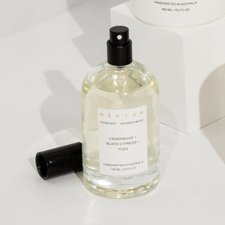 Bottle of Nexxar room mist with a white label on a light background