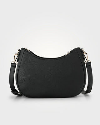 Black handbag with a shoulder strap on a light gray background