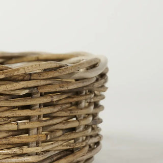 Close-up of a woven basket on a light gray background