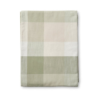 Plaid blanket with green, beige, and white colors on a white background