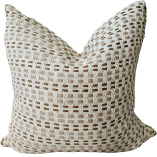 Textured pillow with a woven pattern on a white background